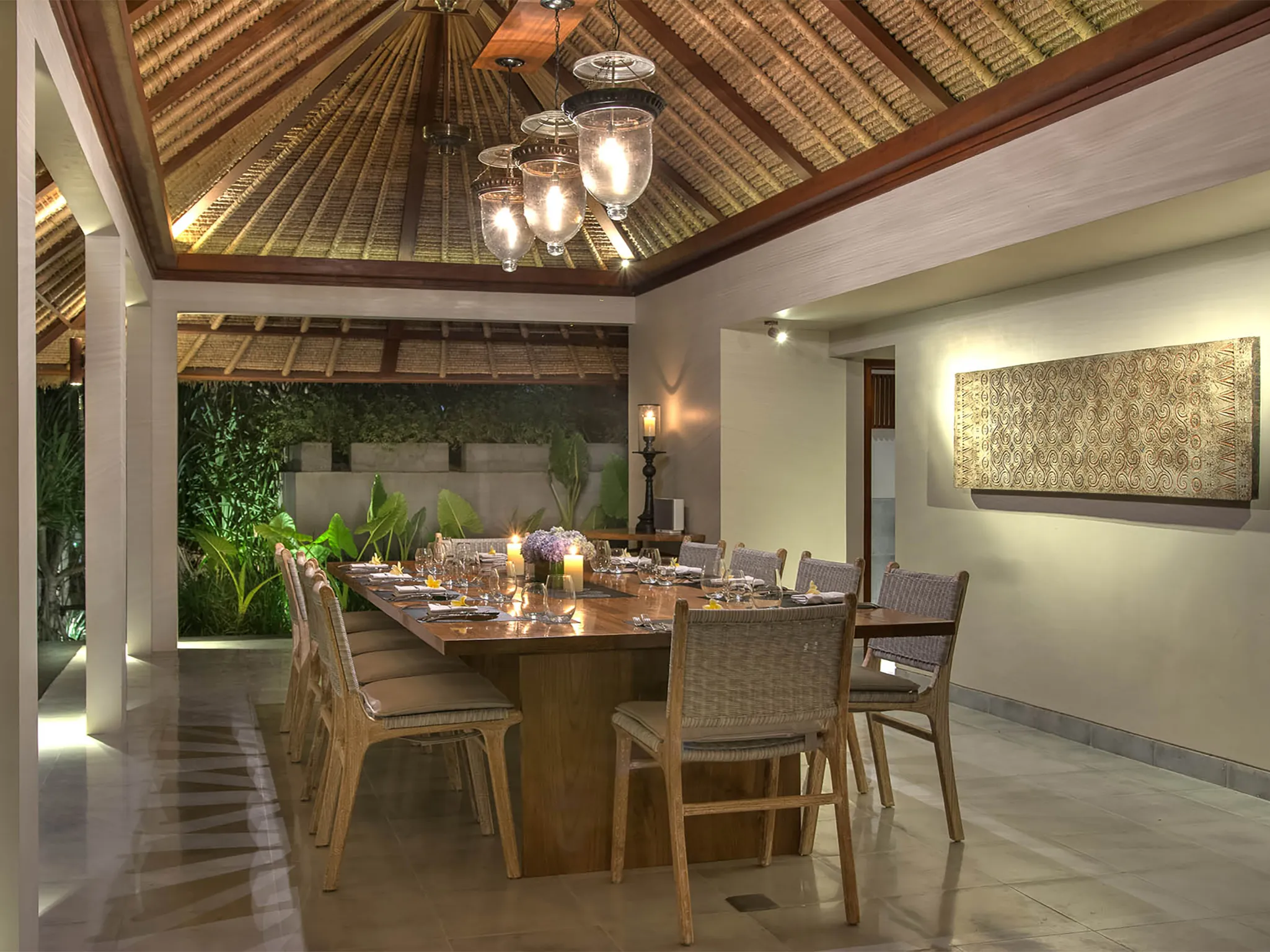 Seseh Beach Villa II - The dining room lit up at night