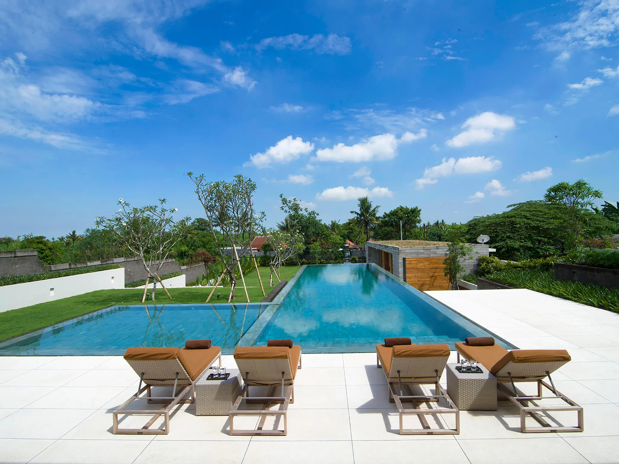 The Iman Villa - Sunloungers by the pool