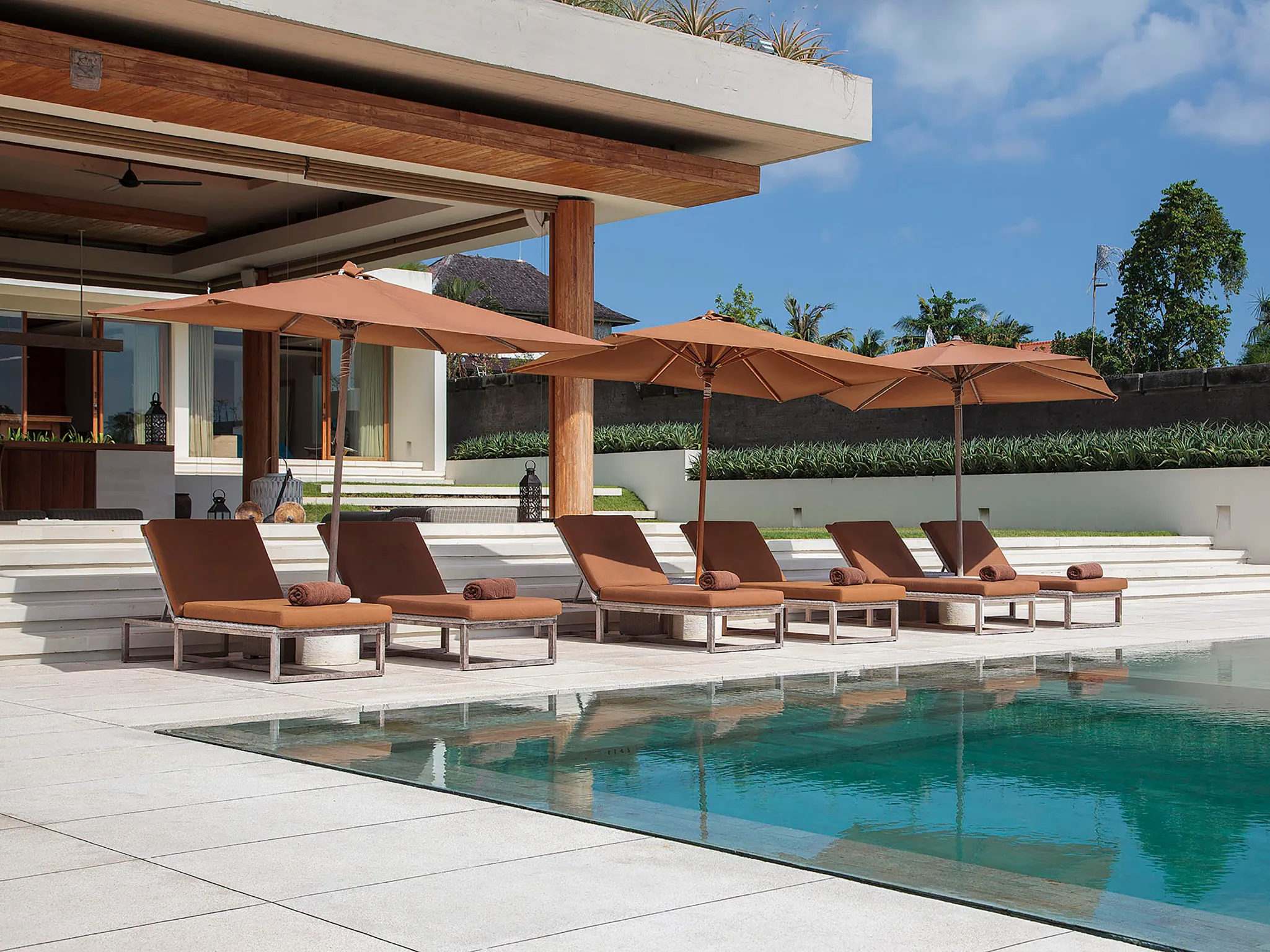 The Iman Villa - Sun loungers by the pool