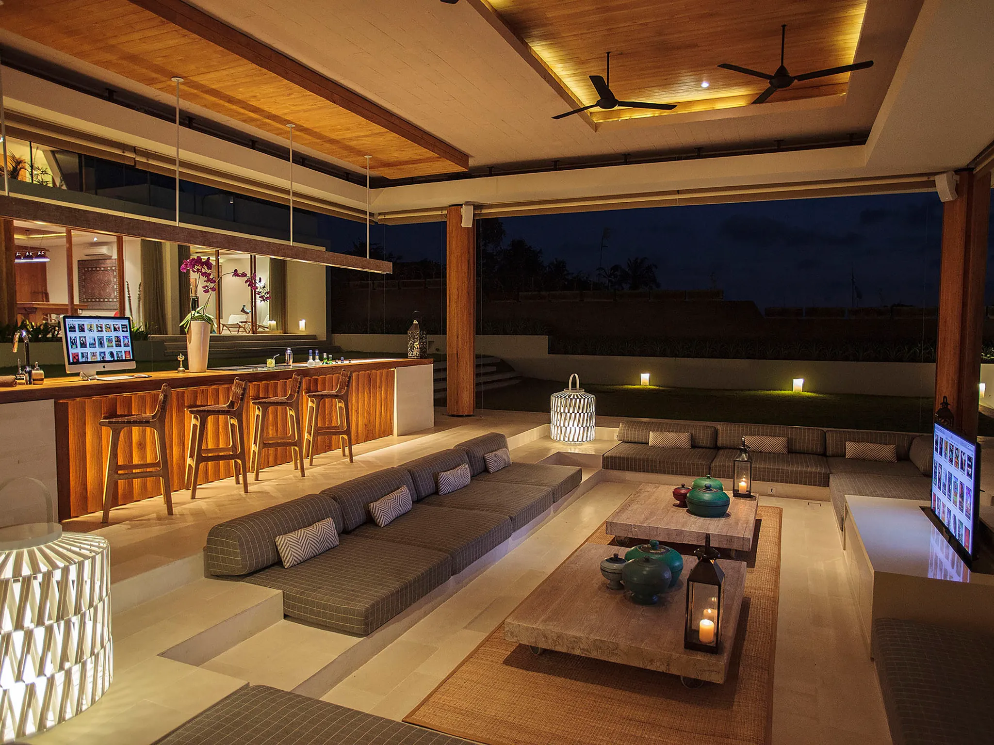 The Iman Villa - Bar and living area at night