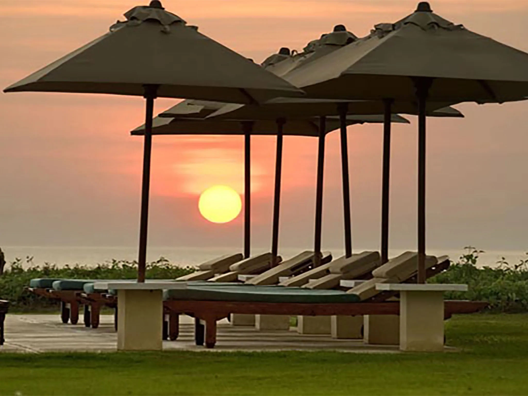 Atas Ombak -  Sunset and umbrellas