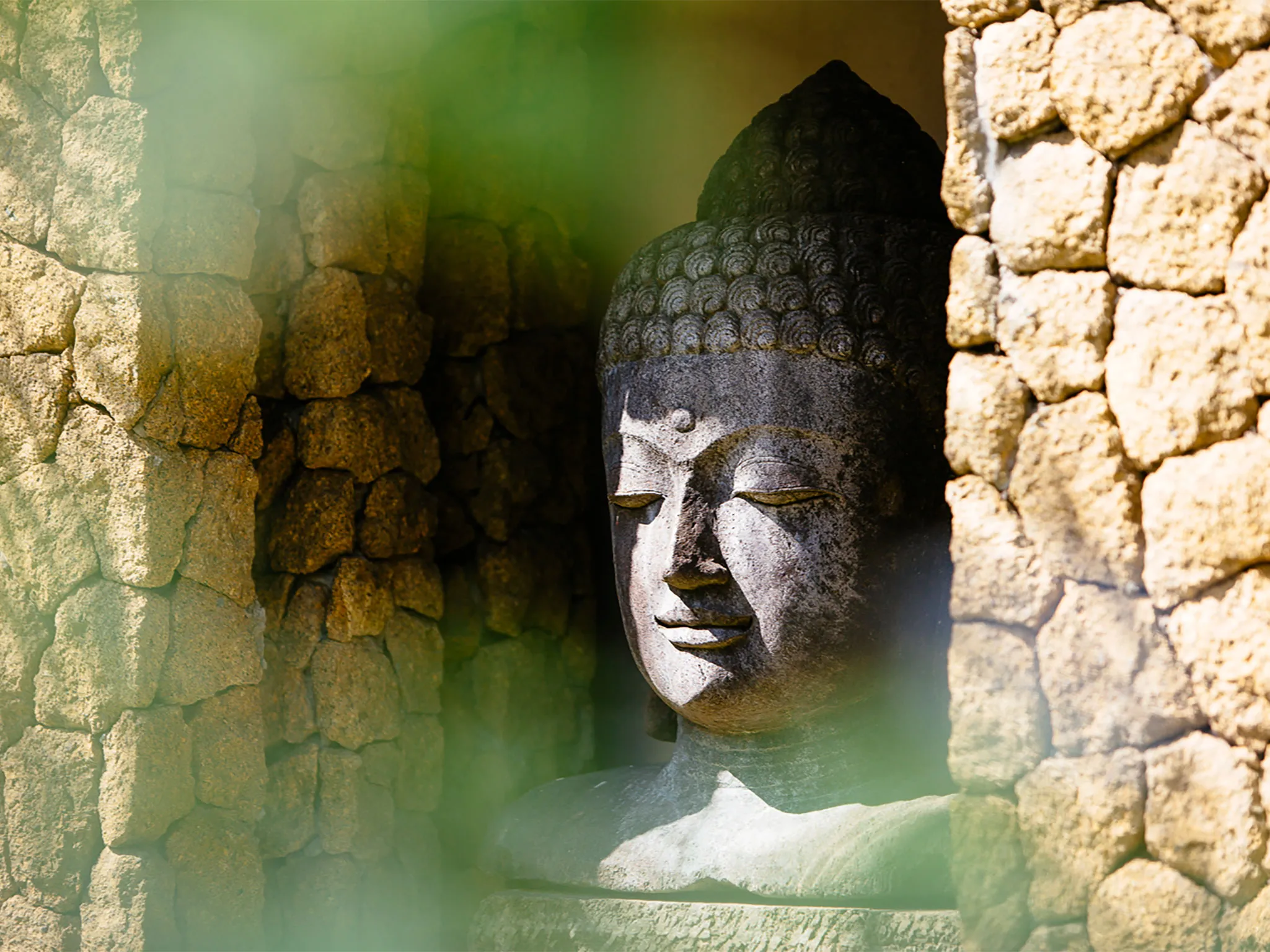 Stone carvings overlook the lawn