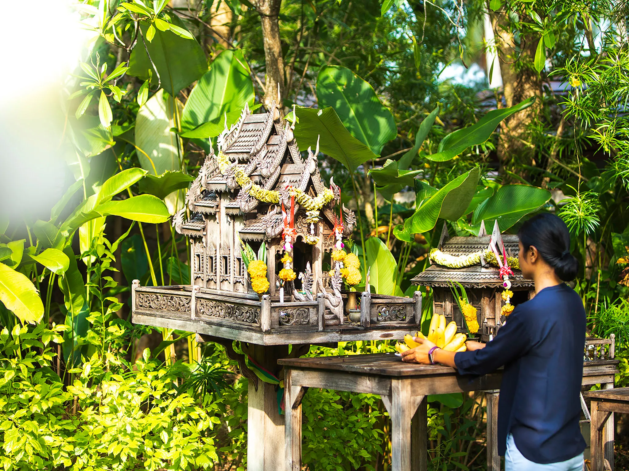 Waimarie - Staff praying at villa temple