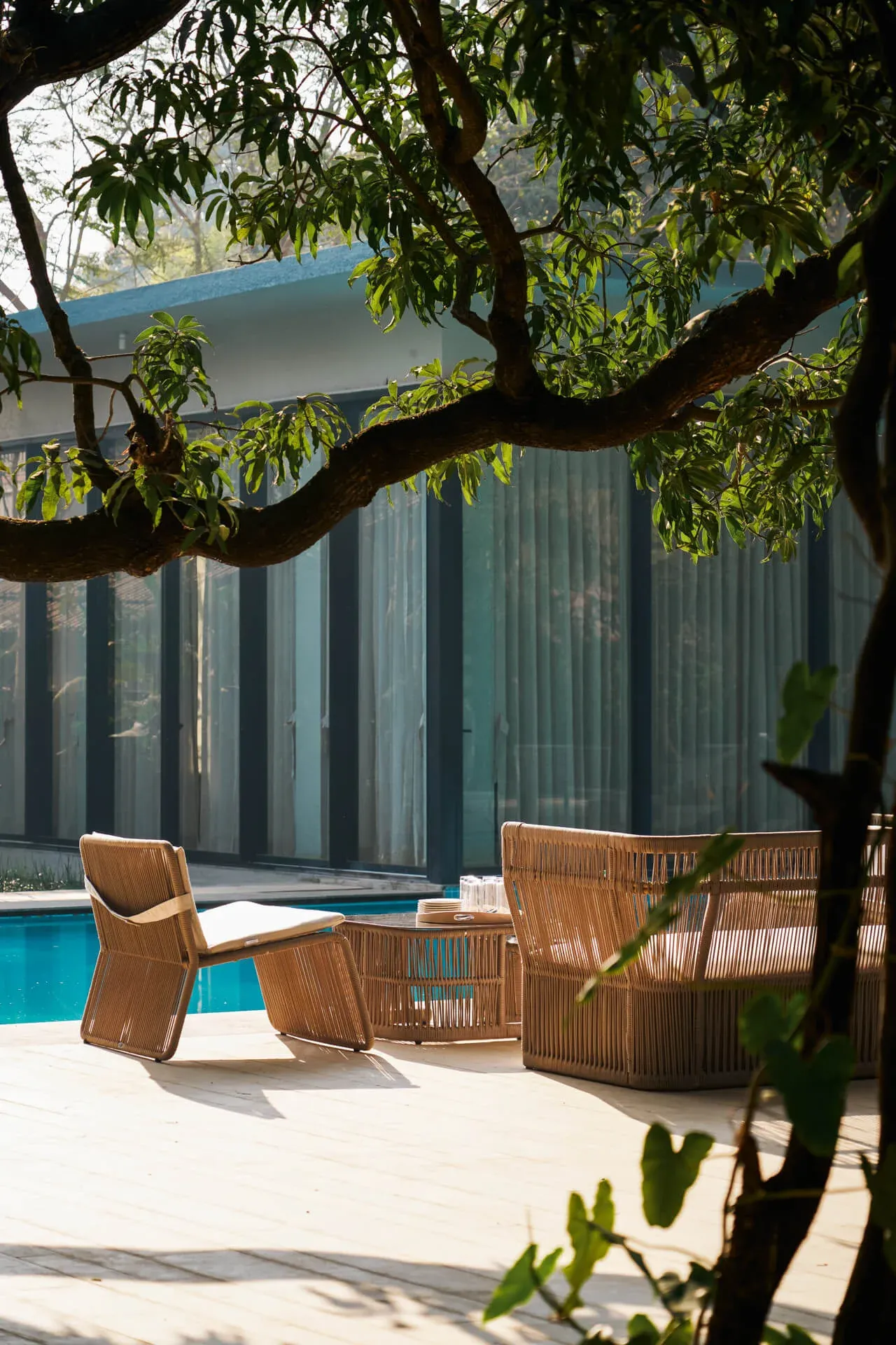 Poolside seating area | Hermes Coves by Lohono Stays