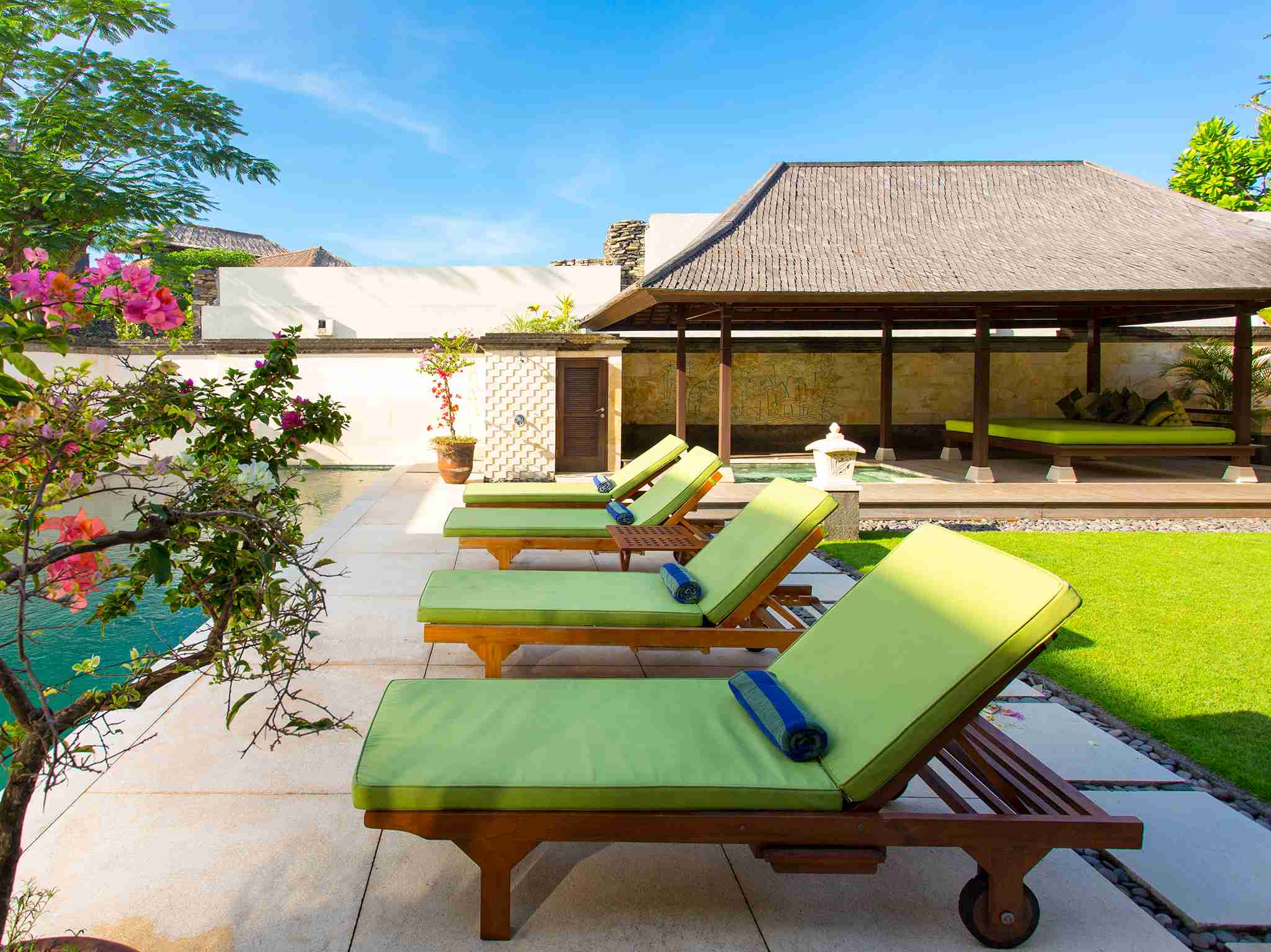 Bayu Gita Residence - Poolside deck chairs
