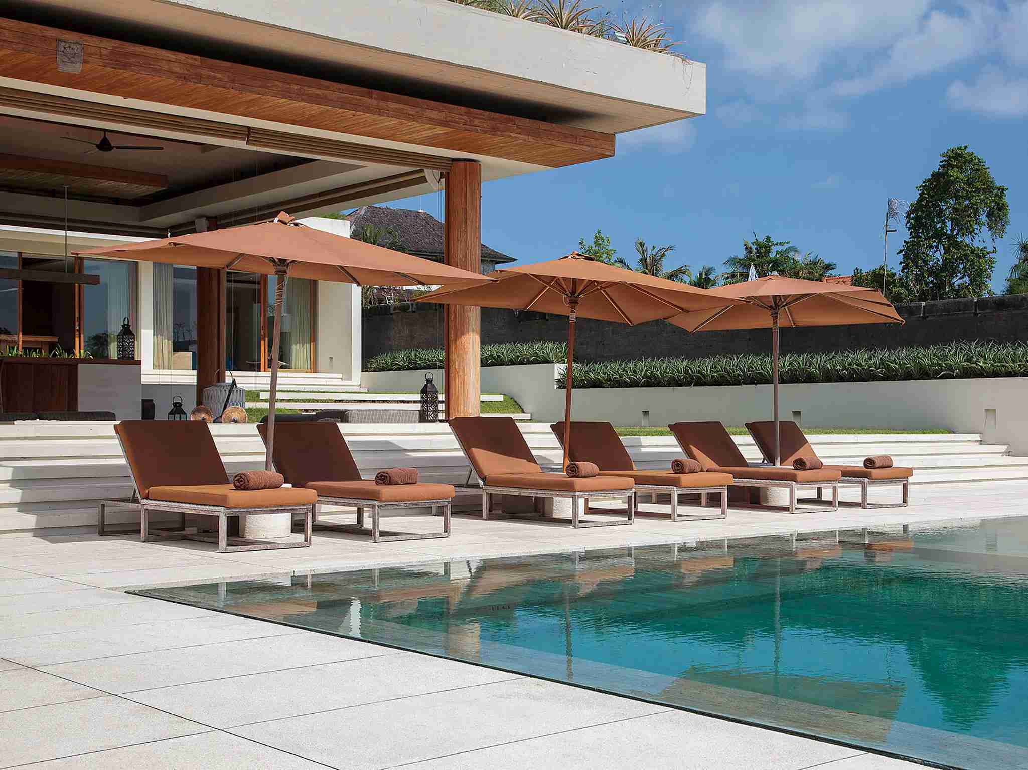 The Iman Villa - Sun loungers by the pool