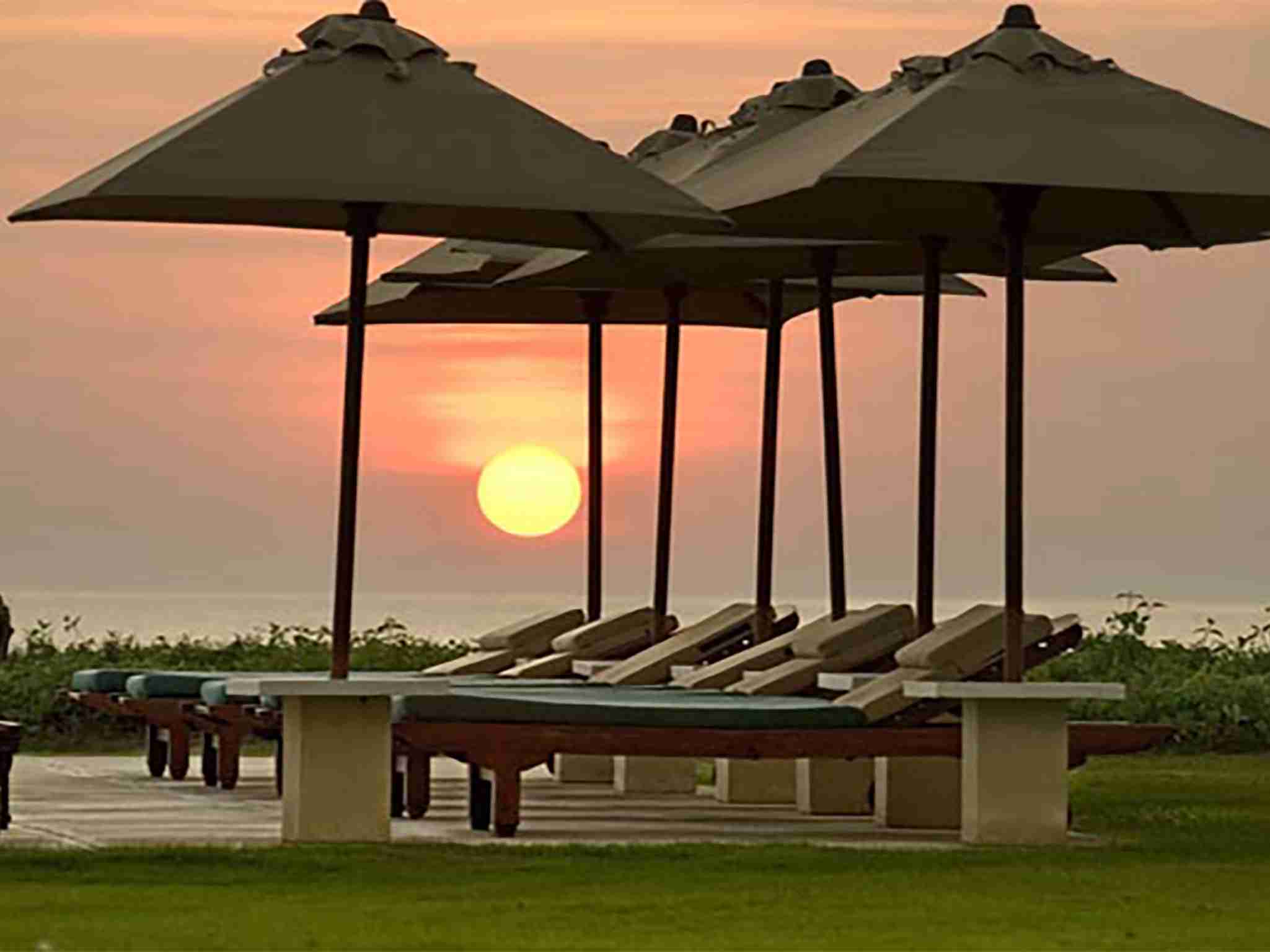 Atas Ombak -  Sunset and umbrellas