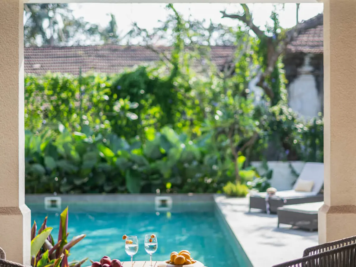 Outdoor Seating at Pool | Estate De Carmo by Lohono Stays