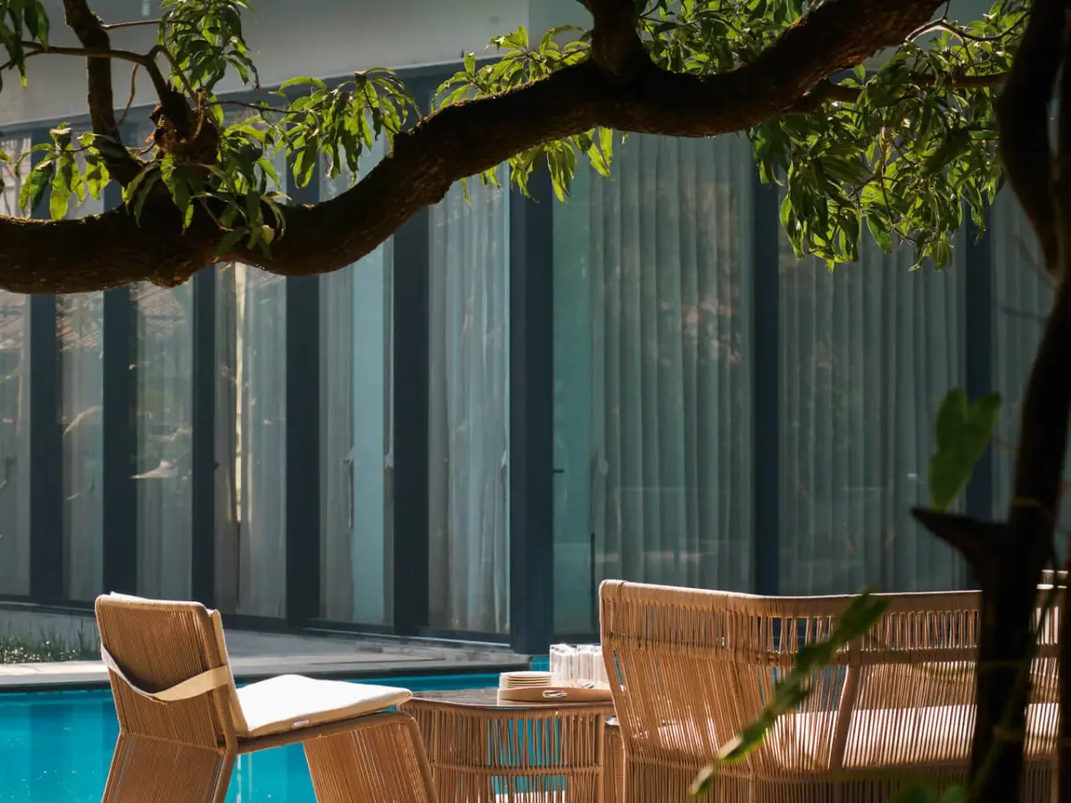 Poolside seating area | Hermes Coves by Lohono Stays