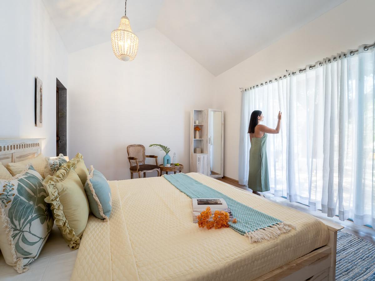 Bedroom with views | Villa Santorini in Alibaug